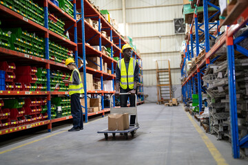  Warehouse workers checking the inventory. Products on inventory shelves storage. .Worker Doing Inventory in Warehouse. Dispatcher in uniform making inventory in storehouse.
