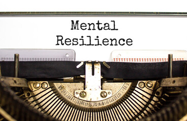 Mental resilience symbol. Concept word Mental resilience typed on retro old typewriter. Beautiful...