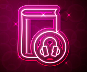 Glowing neon line Audio book icon isolated on red background. Book with headphones. Audio guide sign. Online learning concept. Vector