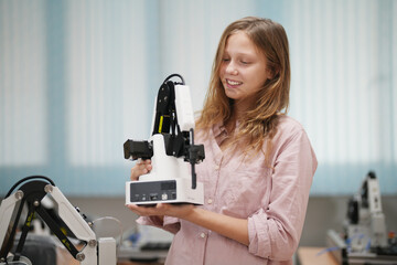 Children learning AI technology Robot with artificial intelligence system on its about the artificial intelligence during science lesson.