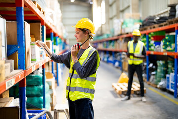 Warehouse Industrial supply chain and Logistics Companies inside. Warehouse workers checking the...