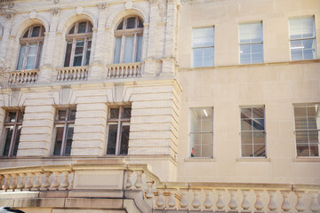 stone buildings with large windows symbolizes stability and strength with a connection to nature. Stone represents durability, while large windows convey openness and a desire for natural light