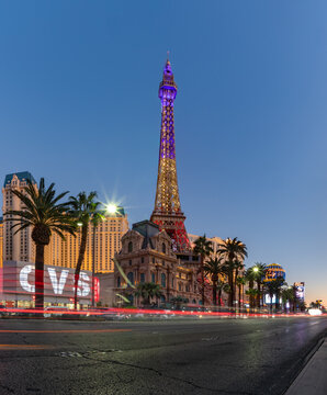 Las Vegas, United States - November 23, 2022: A picture of the Paris Las Vegas at sunset, with the Eiffel Tower decorated with the colors of the French flag.