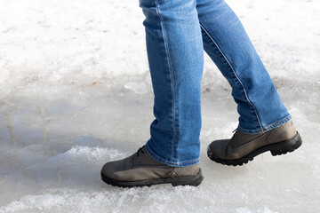 man walking on ice in the park.