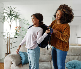child mother family education school girl home daughter backpack help parent getting ready...
