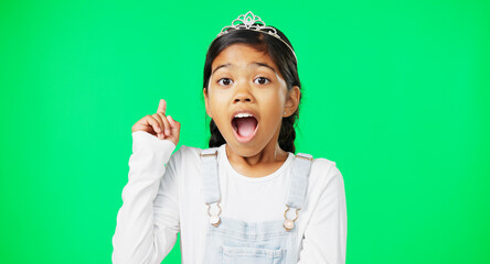 Green screen, idea and portrait of surprised child feeling excited, happy and isolated in a studio background. Smart, clever and young girl or kid pointing up at brand, product placement or mockup