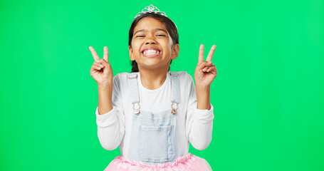 Peace, fun and hand gesture with a girl on a green screen background in studio feeling silly or...