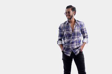 Handsome man posing in isolated white studio background wearing shirt