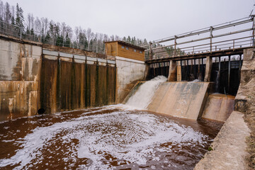 A small hydroelectric power station is located on the river in spring