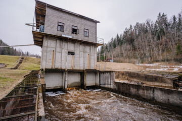 A small hydroelectric power station is located on the river in spring