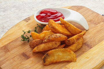 Fried rustic potato with tomato ketcup