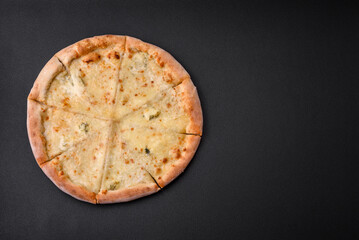Delicious fresh hot pizza four cheeses cut into pieces