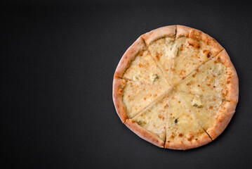 Delicious fresh hot pizza four cheeses cut into pieces