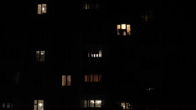 Light in an apartment building. City Blackout. Power outages. Turning on electricity.