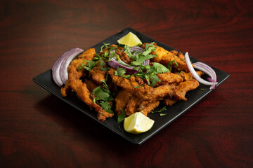 Boneless chicken cubes marinated in Indian spices