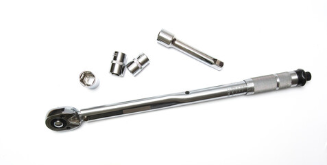 torque wrench on a white background. Adjustable torque wrench spanner hand tool and different nuts.