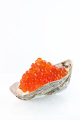 Red caviar in an oyster shell. Great pitch. A useful omega. An exquisite snack. White background....