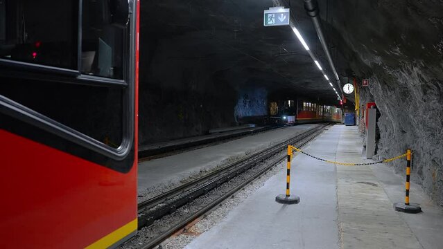 People walking at Jungfraujoch Top of Europe train station in Swiss Alps. A crowd of people inside the highest train station in Europe, Jungfrau, Switzerland.