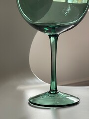 Cropped close up of shiny green gin glass detail in day light