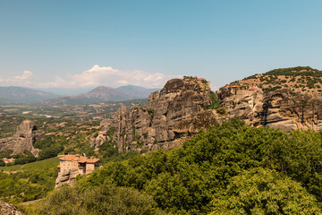 Fototapeta na wymiar Kastraki, Grece - July 15, 2020 - Panorama of Kastraki Village at Meteora with high rocks and monasteries