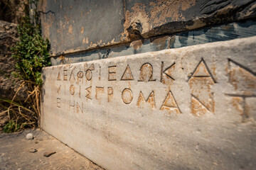 Delphi, Grece - July 15, 2020 - Ancient inscriptions in Delphi sanctuary