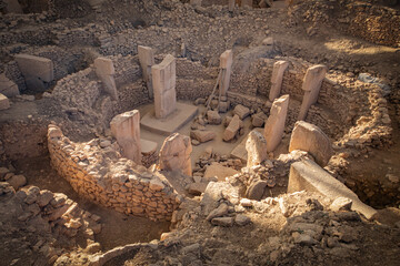 Fototapeta premium Archeological findings in Göbeklitepe excavation site in Turkey. The site has been found in pro-pottery neolithic period between 9500-8000 BCE. Stone works are known as the worlds oldest megaliths.