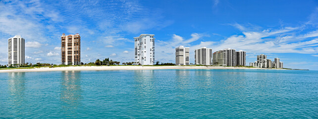 Obraz na płótnie Canvas A panorama of Singer Island, Florida from the Atlantic Ocean, with a white sandy beach and upscale condos.