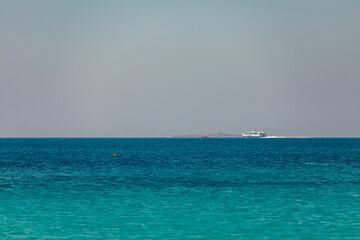 Fototapeta premium Speed boat on the horizon near harbour in Naxos Island, Greece, Europe