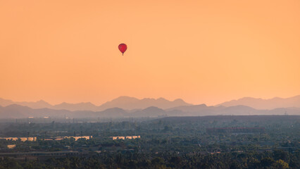 Hot air balloon over Phoenix desert @ Sunset