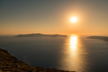 Santorini, Grece - July 23, 2020 -  Amazing red sunset over Oia and caldera of the Santorini island, Greece