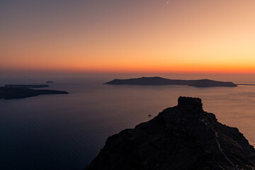 Santorini, Grece - July 23, 2020 -  Amazing red sunset over Oia and caldera of the Santorini island, Greece
