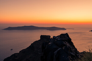 Santorini, Grece - July 23, 2020 -  Amazing red sunset over Oia and caldera of the Santorini island, Greece