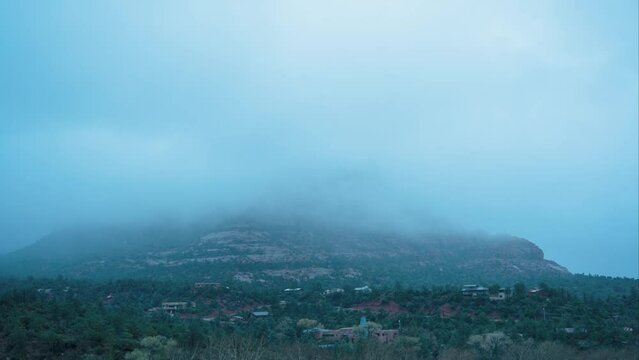 Timelapse of clouds moving over the Snoopy Rock in Sedona, AZ.