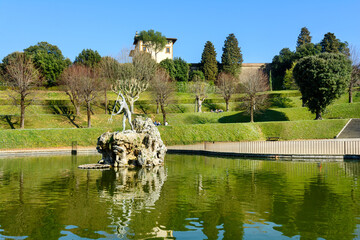 Fountain of Neptune. Boboli Gardens. Florence. Italy. Statue of Neptune with a trident. City park in Florence