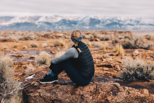 Woman in Mountains at Sunset