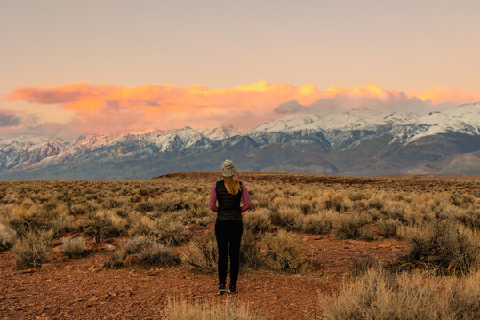 Woman in Mountains at Sunset