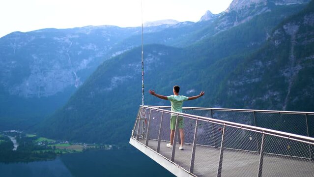View of man is walking in skywalk of Hallstatt platform, Alps, Hallstatt lake
