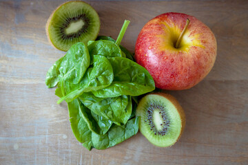 Green health smoothie made from spinach, apples, kiwi. Raw, vegan, vegetarian, detox, alkaline food concept. High quality photo