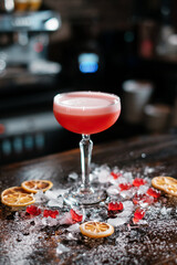 cocktail in a chalet glass on the bar