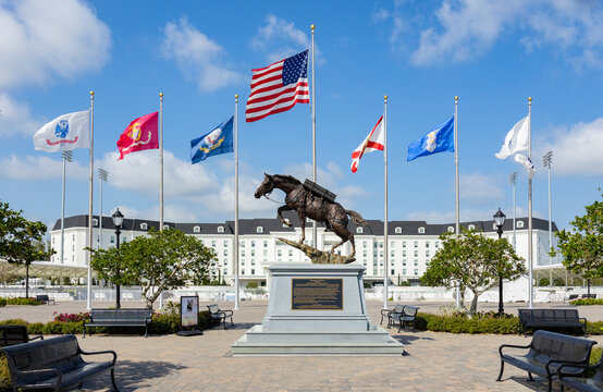 Sargeant Reckless statue at the World Equestrian Center in Ocala, Florida with flags and the hotel in the background.