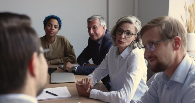 Partied reach agreement, finish formal meeting with handshake, mature businesslady shake hand client accomplish effective negotiations, feel satisfied with cooperation, make deal, succeed commitment