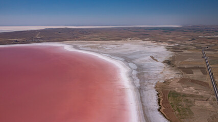 Red bacteria effect formed by water loss and salinization factors in Salt Lake, Turkey.