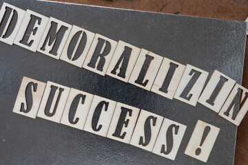 demoralizing success!