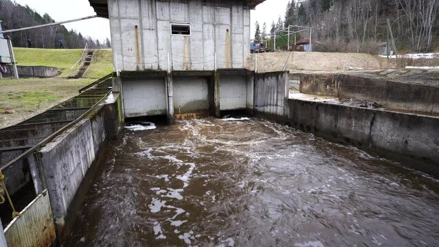 A small hydroelectric power station is located on the river in spring