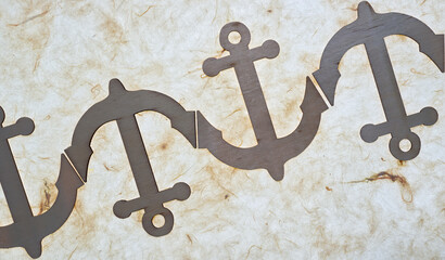 wooden anchor ornaments arranged on tissue paper