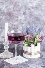 A glass glass-a creamer for drinks with colored drinks. Alcoholic fruit cocktail on a wooden...