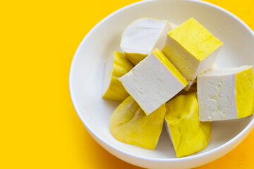 Yellow tofu on yellow background.