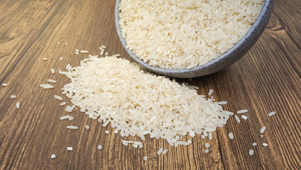 Rice in bowl wooden background. selective focus
