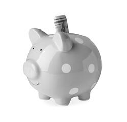 Piggy bank with banknotes on white background