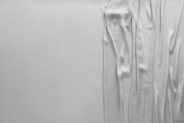 Beautiful grey tulle fabric as background, top view. Space for text